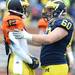 Michigan quarterback Devin Gardner chats with teammate offensive linesman Jack Miller during spring practice at Michigan Stadium on Saturday, April 13, 2013. Melanie Maxwell I AnnArbor.com